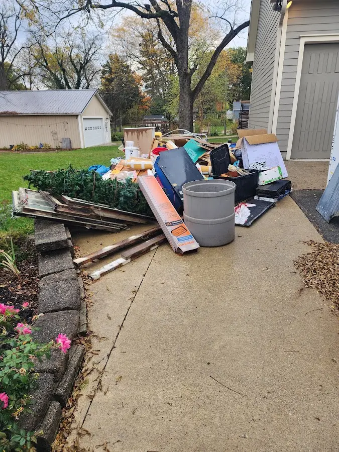 Dumpster being loaded with debris for 30 Yard Dumpster Rental in Salem Heights